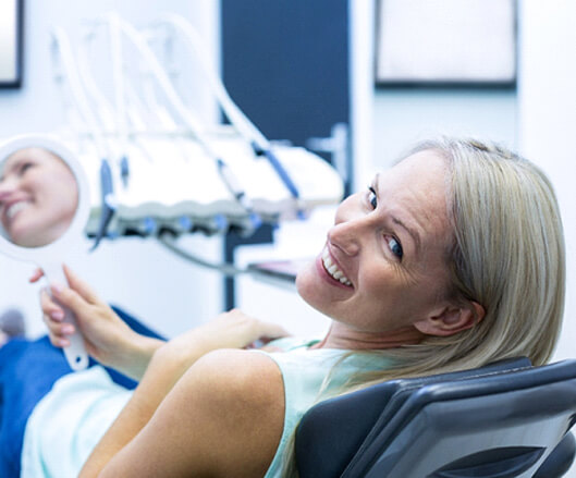Woman smiling after her dental checkup