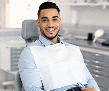 Smiling patient sitting in treatment chair