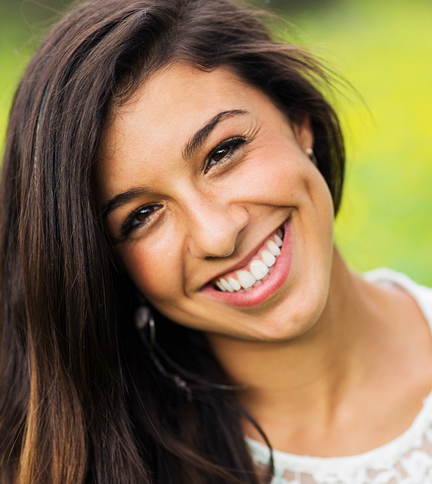 Woman sharing smile after cosmetic dentistry treatment