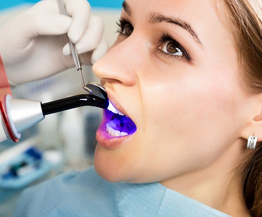 Woman receiving dental bonding treatment