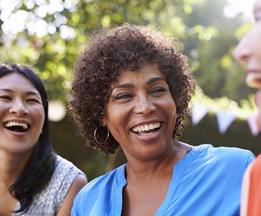 Older woman with denture smiling