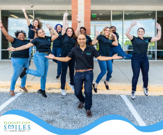 dentist holding tooth with tool 