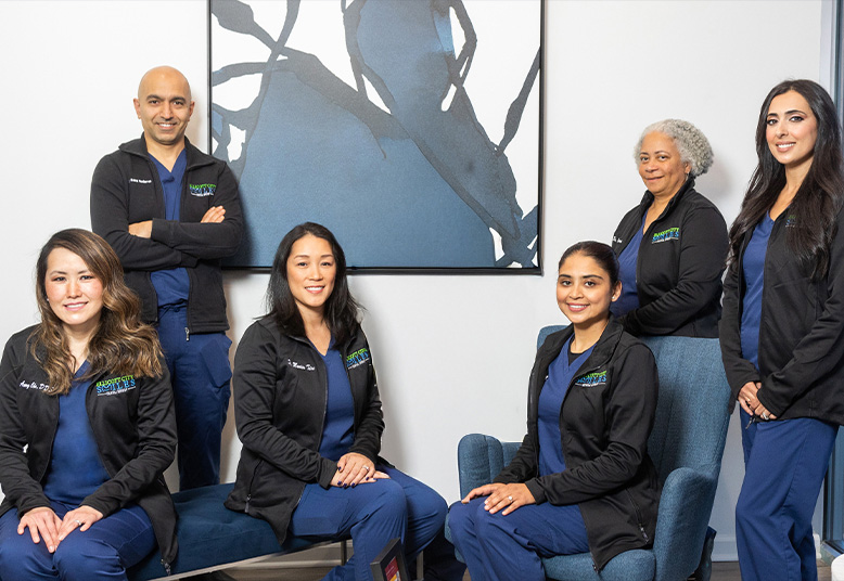 Four smiling dentists in Ellicott City