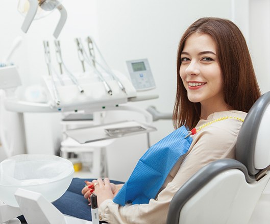 Smiling, relaxed dental patient thanks to sedation options