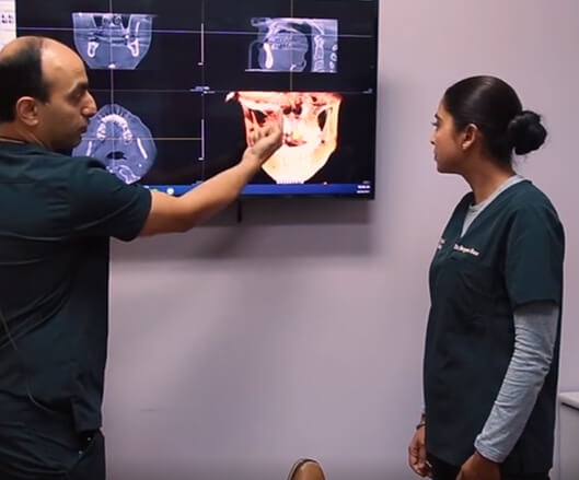 Doctor Khatra and Doctor Modarress reviewing patient x-rays