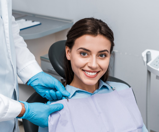 smiling woman in chair