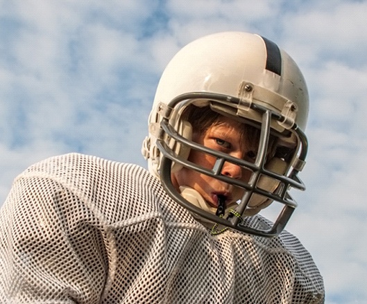 Boy wearing mouthguard in Ellicott City