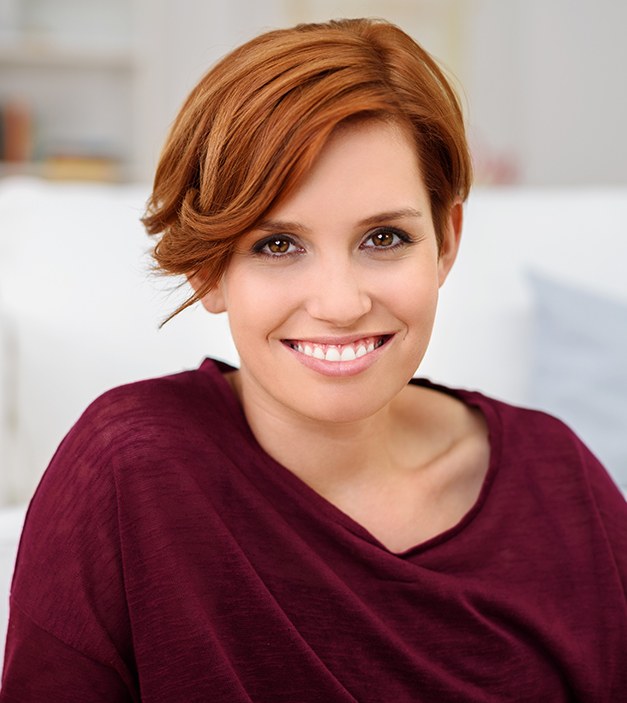 Woman with healthy smile after periodontal therapy