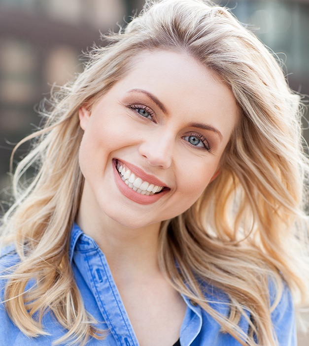 Woman sharing smile after porcelain veneer placement