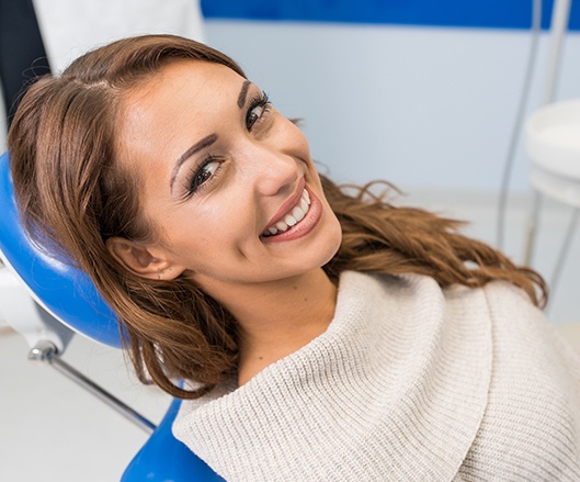 Woman smiling after dental checkup and teeth cleaning