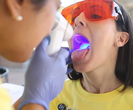 Patient receiving oral cancer screening