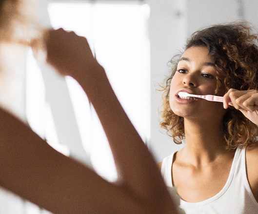 Woman brushing her teeth