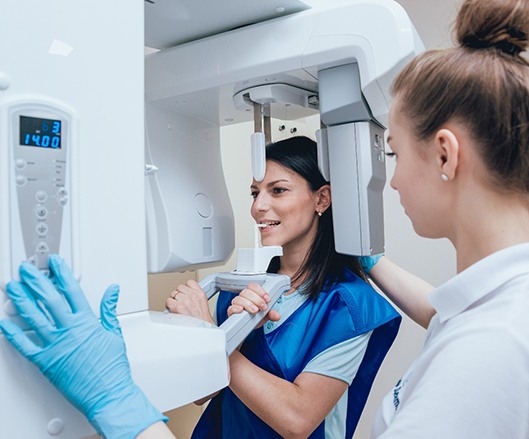 a woman receiving a CBCT scan