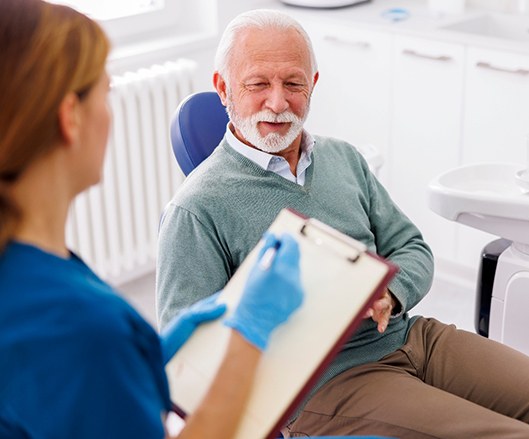 a man speaking with a dentist