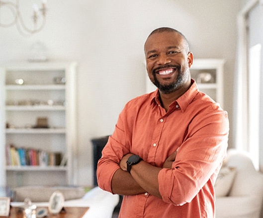 Man smiles confidently after smile makeover in Ellicott City