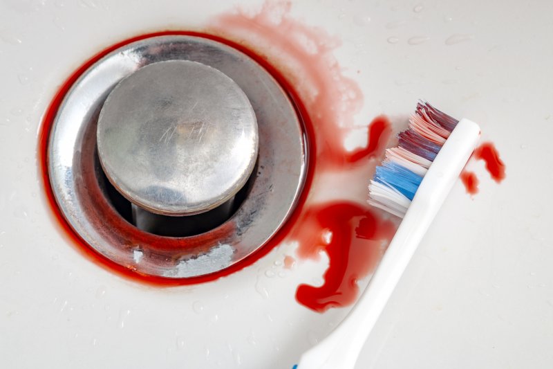 Blood on toothbrush from gum disease in Ellicott City