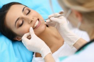 cosmetic dentist treating patient for gum disease