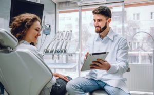 woman discussing the cost of sedation dentistry with her dentist