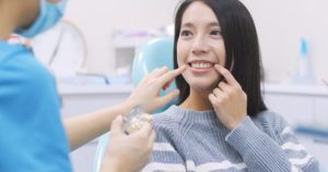 Woman at consultation to fix small teeth