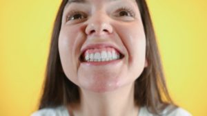 person with uneven gumline