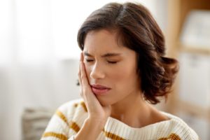 Woman suffering from a toothache.