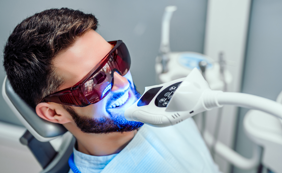Man getting dental whitening treatment